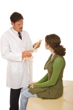 chiropractor advising treatment to a patient 